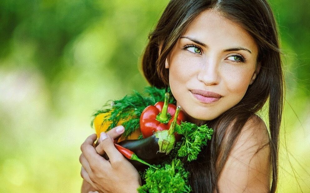 girl holding vegetables to cleanse the body of parasites
